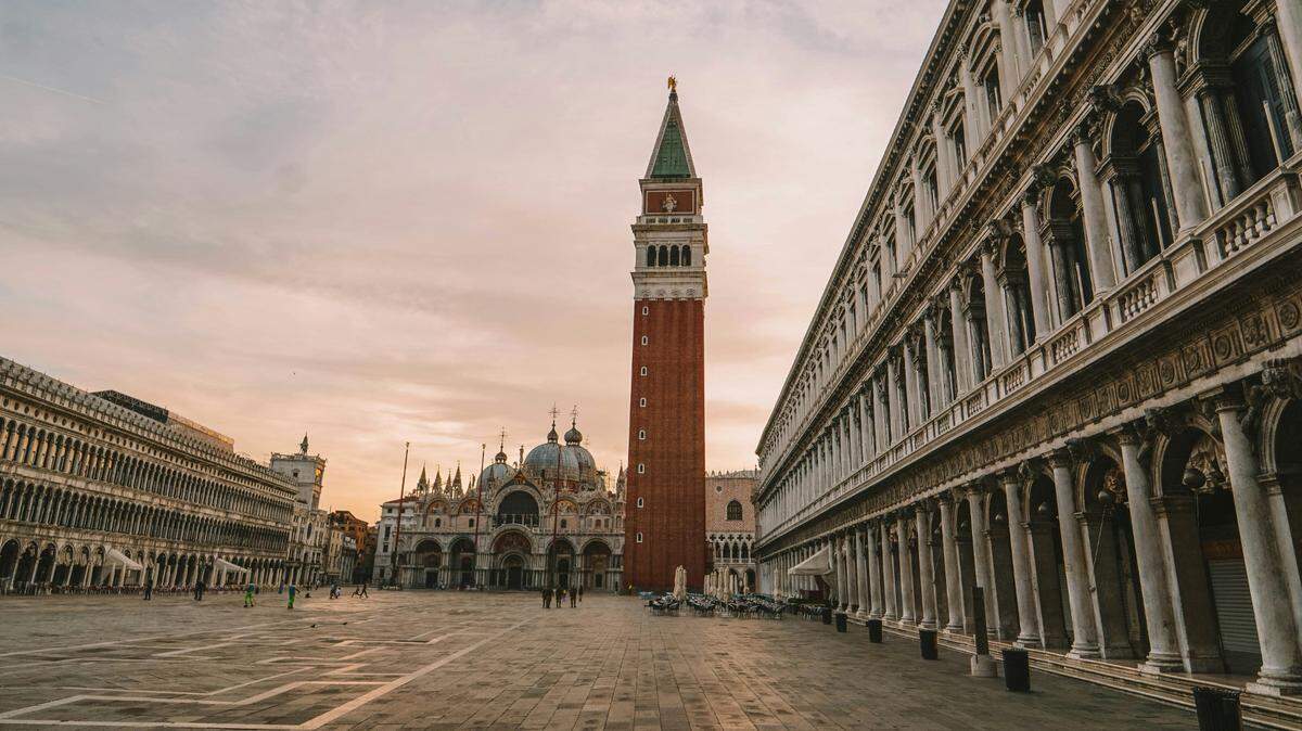 Archaeologists in Italy unearthed a stone tomb and building ruins under the Piazza San Marco and found a lost medieval church, photos show.