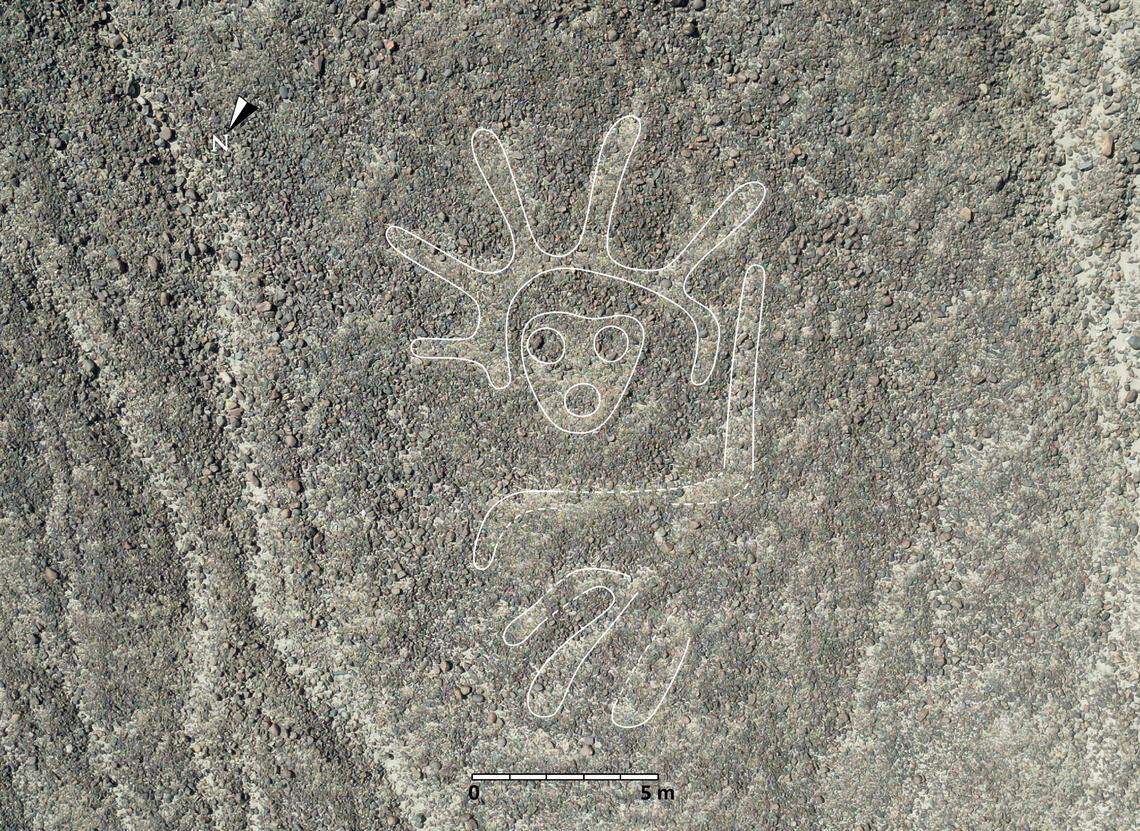 A 2,000-year-old Nazca geoglyph showing a humanoid. The figure was outlined in white by researchers.