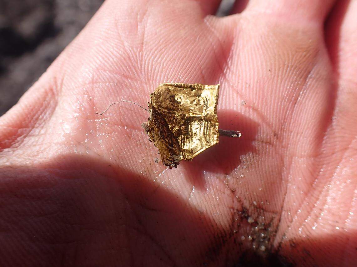 Mikkel Killingmoe Christensen holds the 1,200-year-old gold foil.