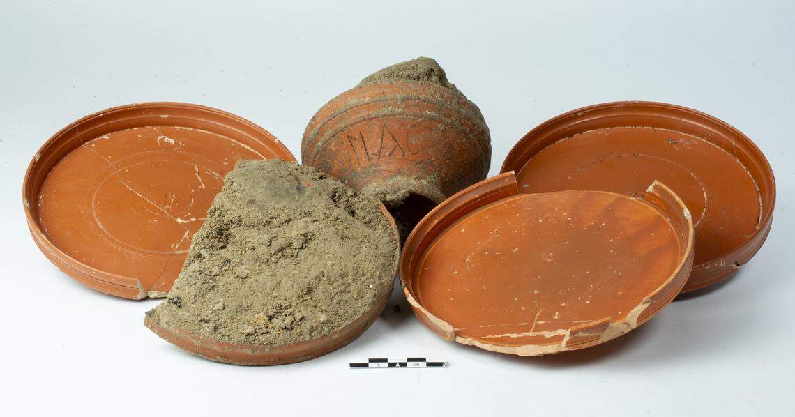 Some of the artifacts, including the personalized bowl, found in the grave.