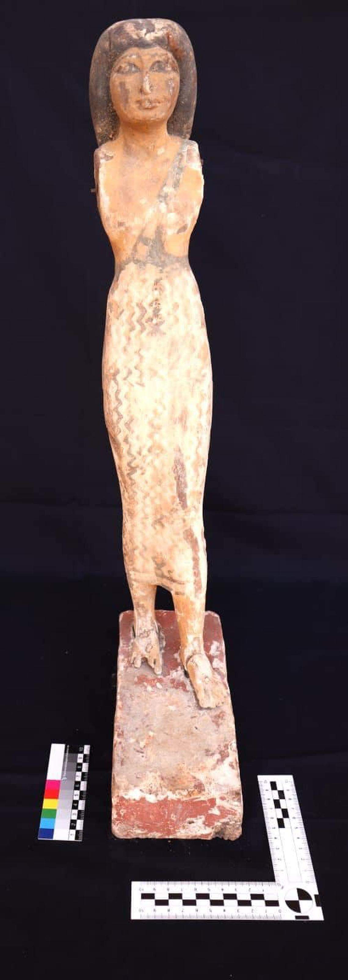A carved figure found inside the ancient burial chamber.