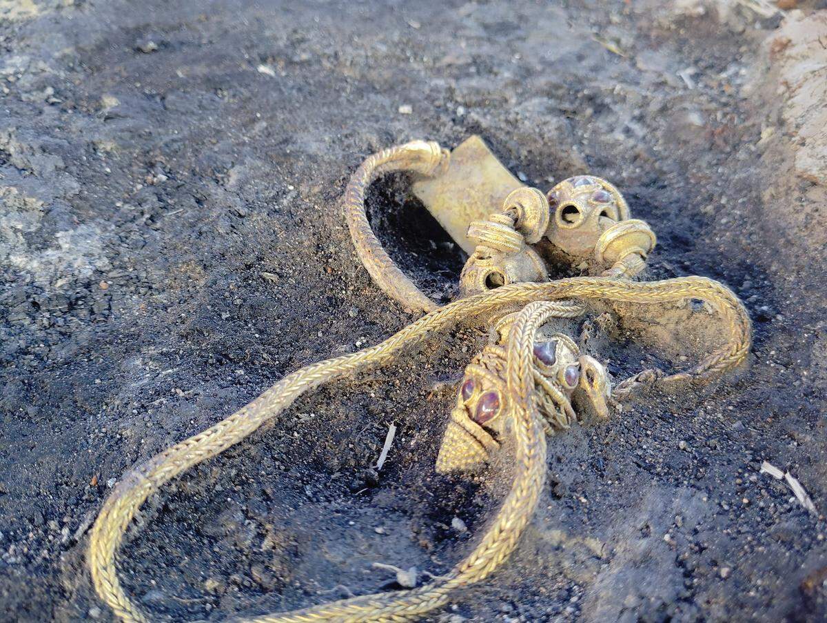 A gold necklace found in the ancient grave.