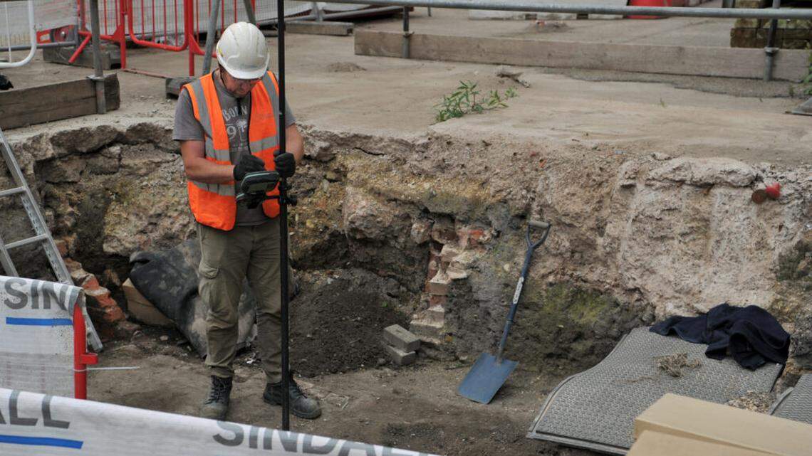 A medieval church and burials were discovered as a university transforms a shopping center into an urban campus in the U.K.