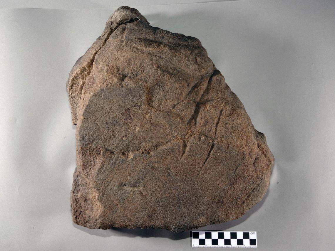The underside of the ancient millstone.