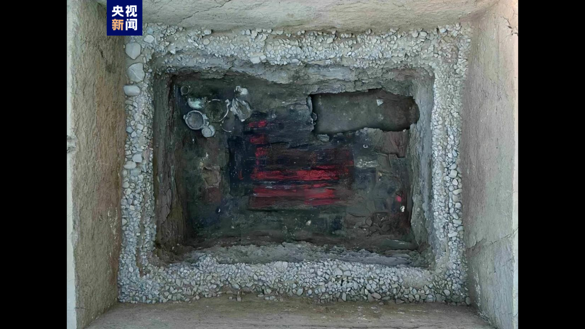 Archaeologists in Shanxi found a 2,400-year-old tomb looted by a grave robber with rare musical instruments and artifacts still inside, photos show.
