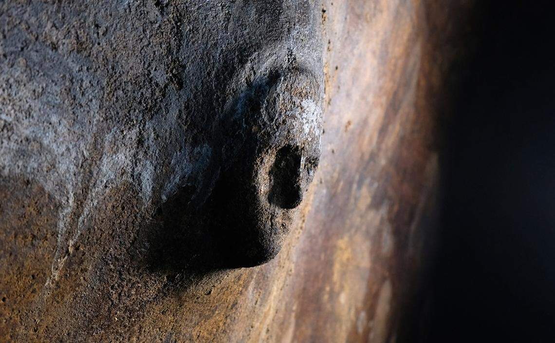A carved mask found inside one of the underground cisterns.