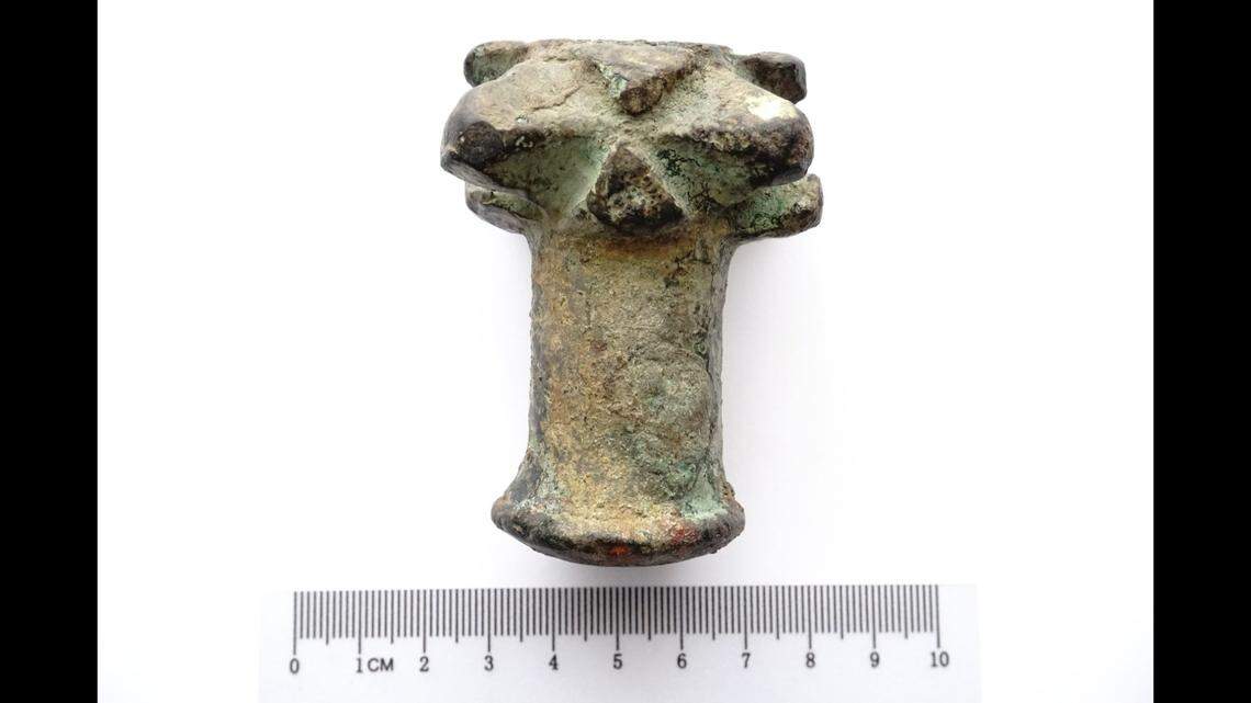 A boy found a spiky weapon head from over 600 years ago in a driveway in Poland after extra dirt was recently added, archaeologists said and photos show.