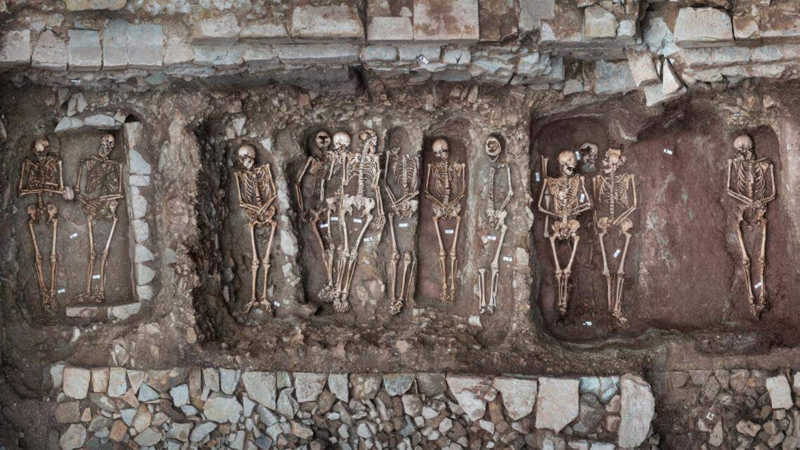 Archaeologists excavated a ruined monastery in Posa and uncovered 15 densely packed burials dating between 500 and 800 years ago, photos show.