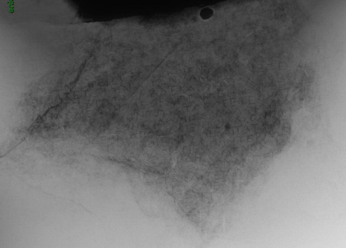 A scan shows the inscribed bronze tablet.