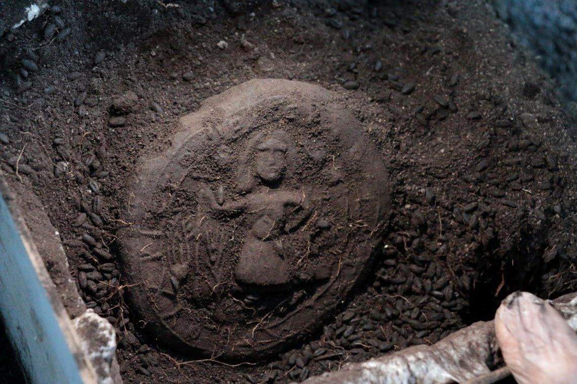 A 1,200-year-old loaf of Communion bread with a Jesus figure on it found at Topraktepe.