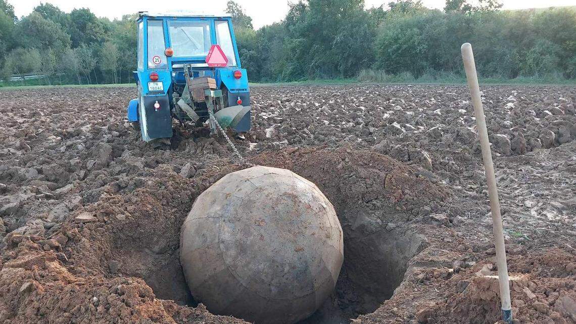 A farmer plowing a field in Kostolná-Záriečie hit a “rock” and found an unusual artifact from World War II, photos show and officials said.