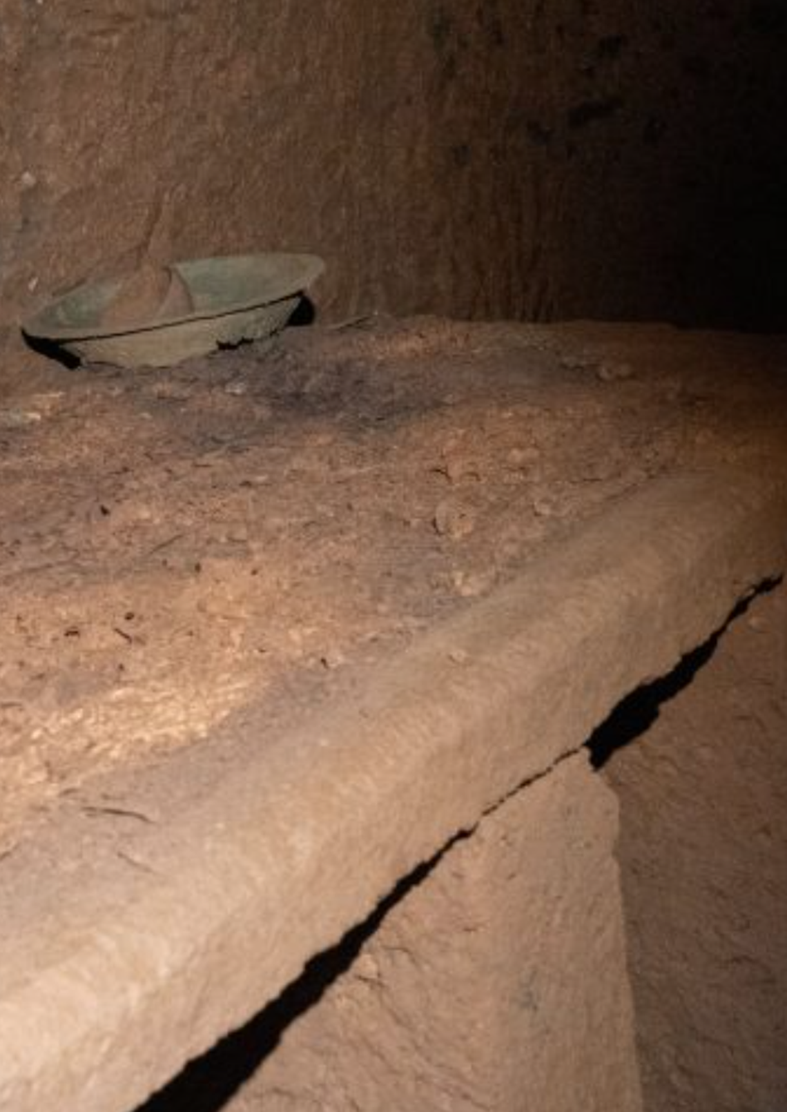 One of the funerary beds next to the doorway of the 2,600-year-old tomb.