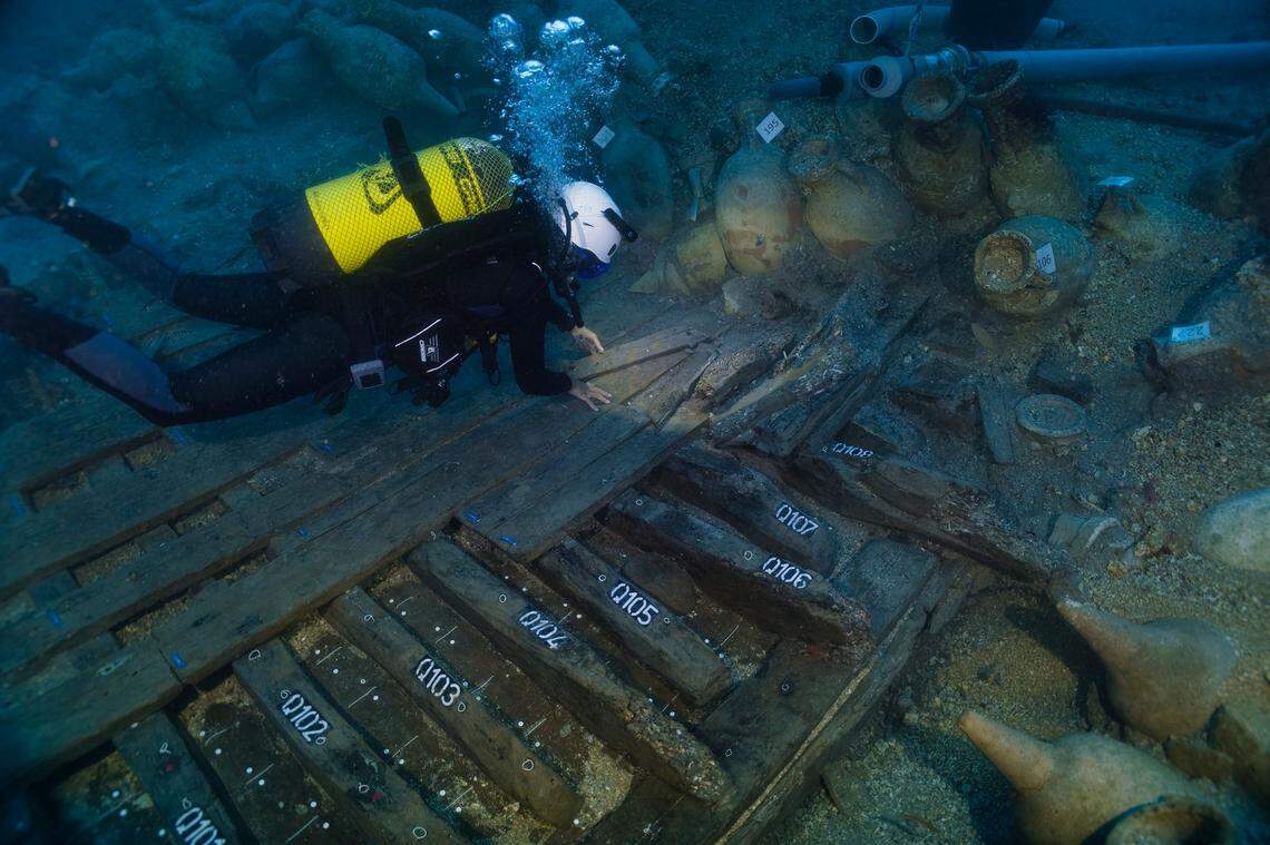 Divers excavate the ancient Roman shipwreck.