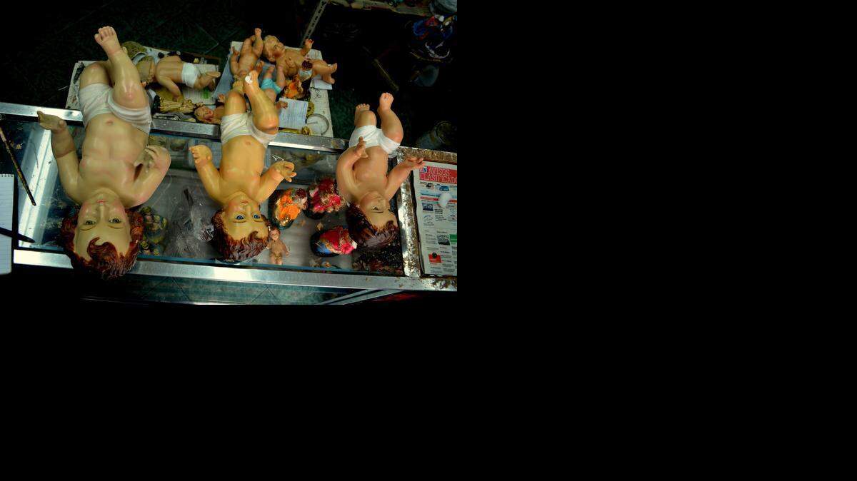
Baby Jesus figures wait to be re-painted in Gonzalo Gallardo’s workshop in Quito, Ecuador. Gallardo is an ‘encarnador’ - when he’s not fixing saints and icons, he uses his skill on flesh-and-blood clients.
