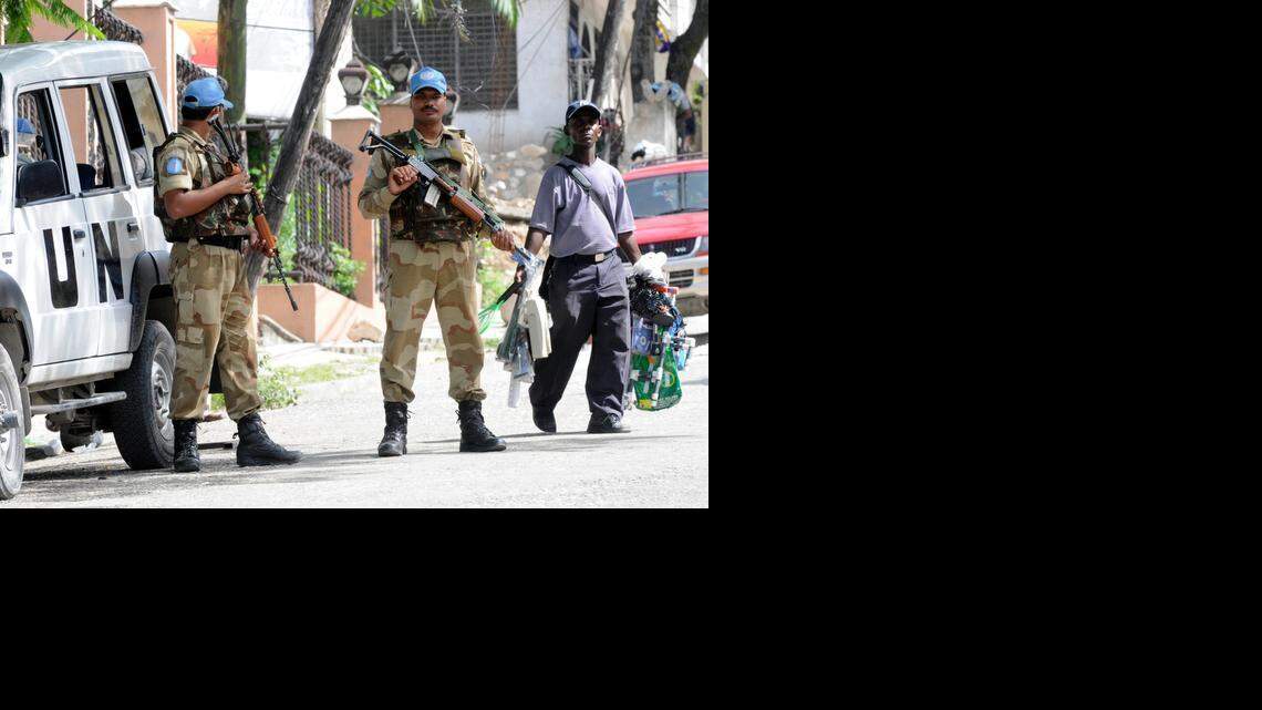 
U.N. troops from India guard the electoral council headquarters in Petionville, Haiti, before the 2010 elections. 
