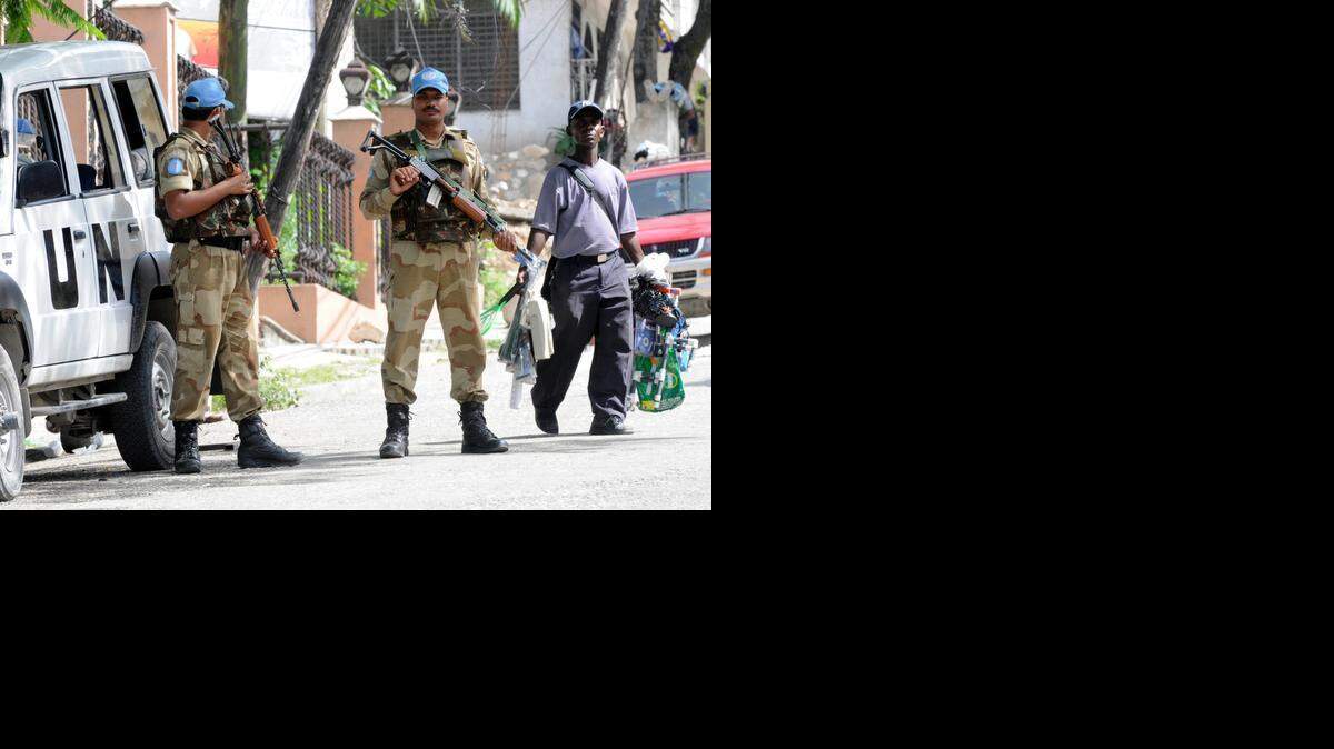 
U.N. troops from India guard the electoral council headquarters in Petionville, Haiti, before the 2010 elections. 

