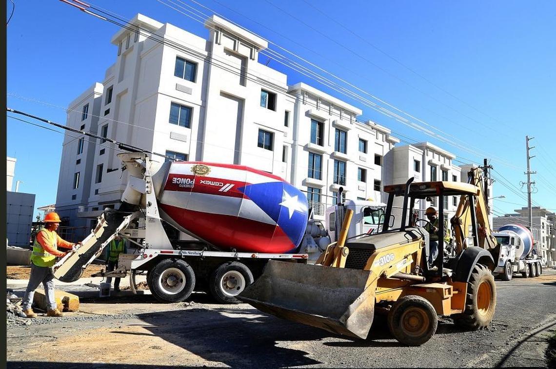 Contractors work on final details at ‘Las Gladiolas,’ a new government housing project close to being finished in Hato Rey in San Juan, on Friday, Dec. 01, 2017.