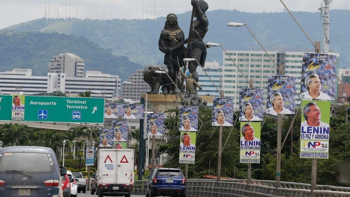 Cars cross a bridge lined with campaign posters promoting ruling party presidential candidate Lenin Moreno, in Guayaquil, Ecuador, Wednesday, March 29, 2017. Ecuador will hold a runoff election Sunday to choose a successor for President Rafael Correa, who led the South American country for 10 years.