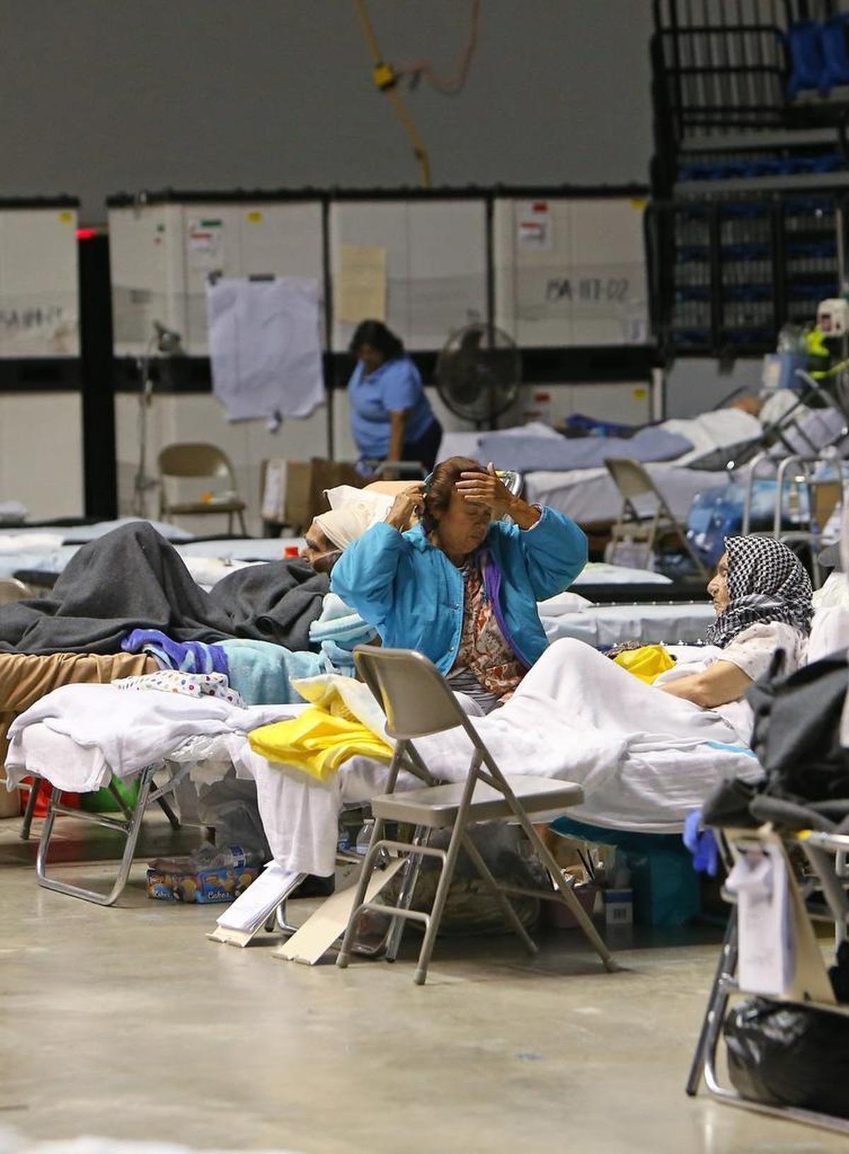 A view of medical staff working with patients at a federal medical shelter set up in a sports stadium in Manati, Puerto Rico after Hurricane Maria. The hospital is staffed by a team from the National Disaster Medical System and by volunteers from New York hospitals.