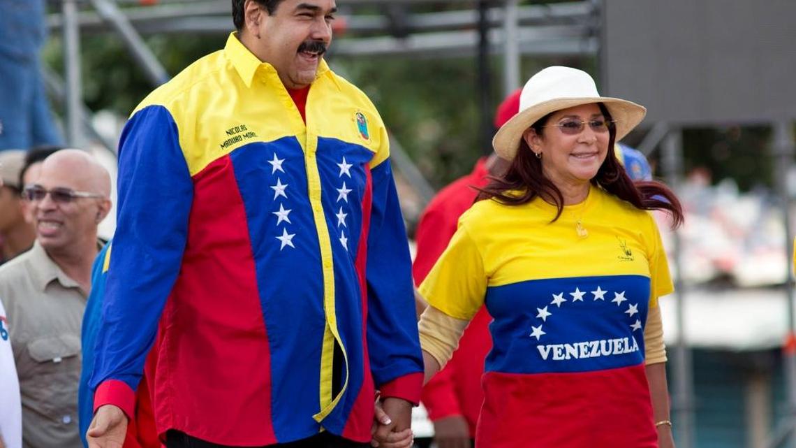 MaduroVenezuela’s President Nicolas Maduro and first lady Cilia Flores jump during the closing campaign rally in Caracas, Venezuela. Venezuelans on Sunday elected the opposition to a super majority in the assembly.