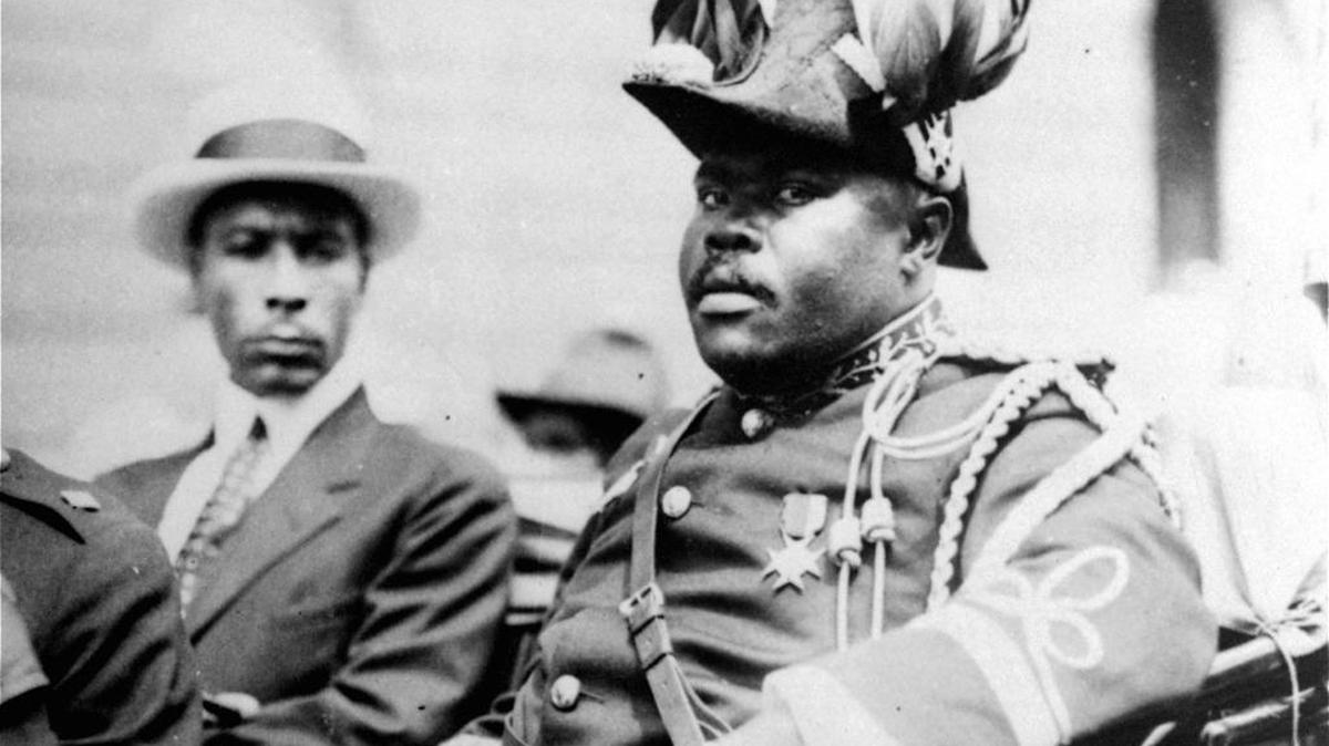 In this August 1922 file photo, Marcus Garvey is shown in a military uniform as the "Provisional President of Africa" during a parade on the opening day of the annual Convention of the Negro Peoples of the World along Lenox Avenue in Harlem borough of New York. The son of Marcus Garvey on Aug. 17, 2016, said his father’s 129th birthday marked the perfect day to begin a public push for a presidential pardon to exonerate Garvey for an unjust conviction. Dr. Julius W. Garvey wants President Barack Obama to clear his father’s name from a mail fraud conviction that caused Marcus Garvey to be deported from the United States to his native Jamaica.