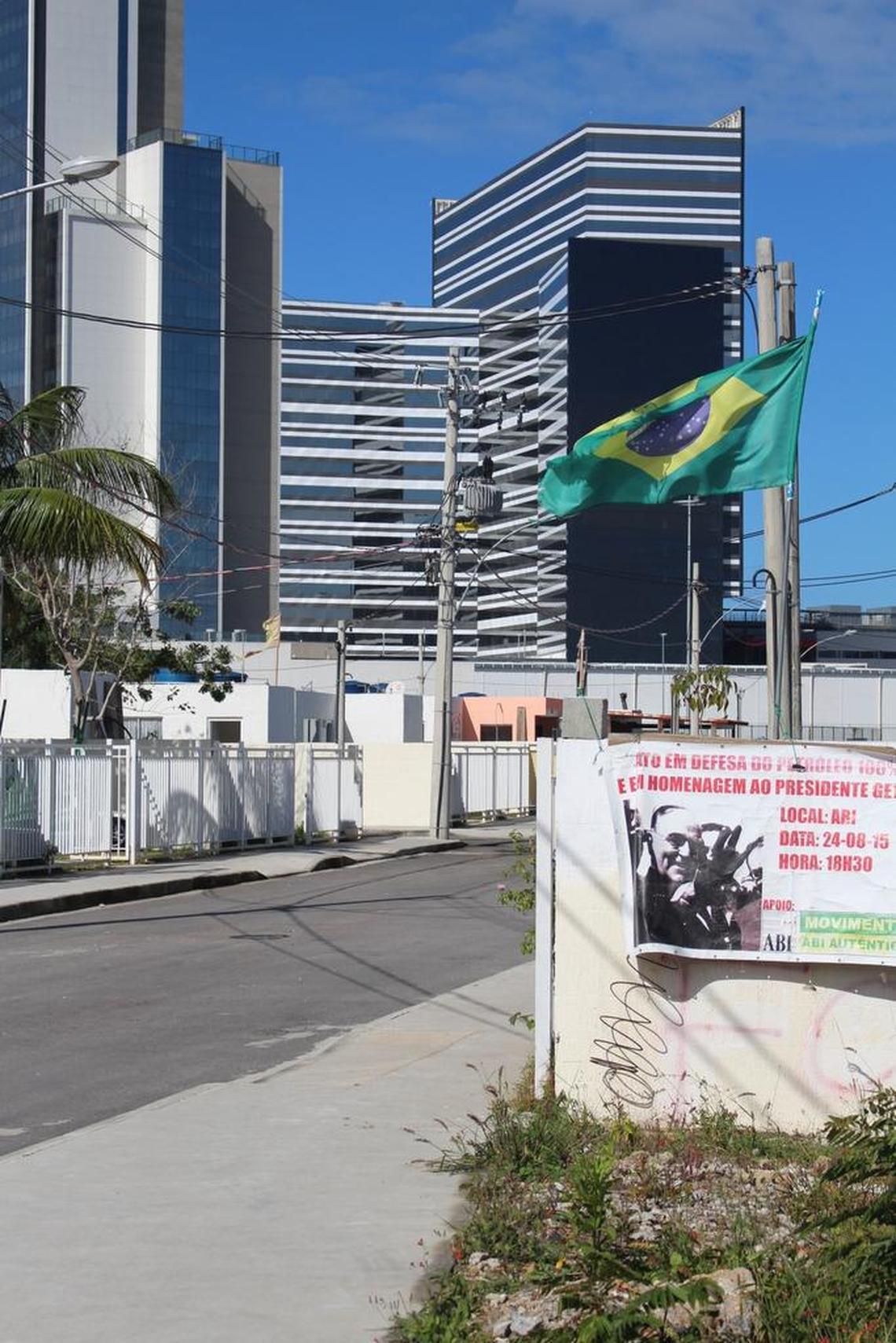 A Marriott Courtyard and the broadcast and press center for the Rio Olympics can be seen in the distance from the single street that is now the Vila Autódromo community.