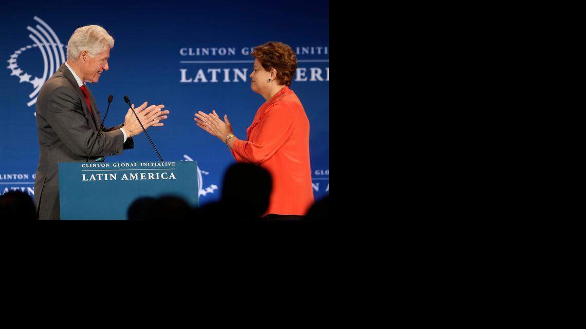 
Former President Bill Clinton, left, and Brazil's President Dilma Rousseff applaud each other at a CGI Clinton Global Initiative Latin America event at the Copacabana Palace in Rio de Janeiro, Brazil, Monday, Dec. 9, 2013. The meeting brought together Latin American leaders to identify, harness, and strengthen ways to improve the livelihoods of people in Latin America and around the world. Clinton is planning a “Future of the Americas” summit on Dec. 11 in Miami. 
