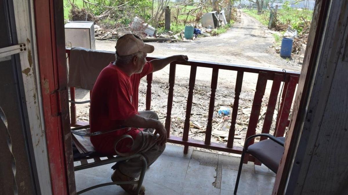 Alberto Cabrera, 60, is the youngest person in Media Luna, Puerto Rico. Here he takes a break after helping clean out the damaged house of a 93-year-old neighbor.