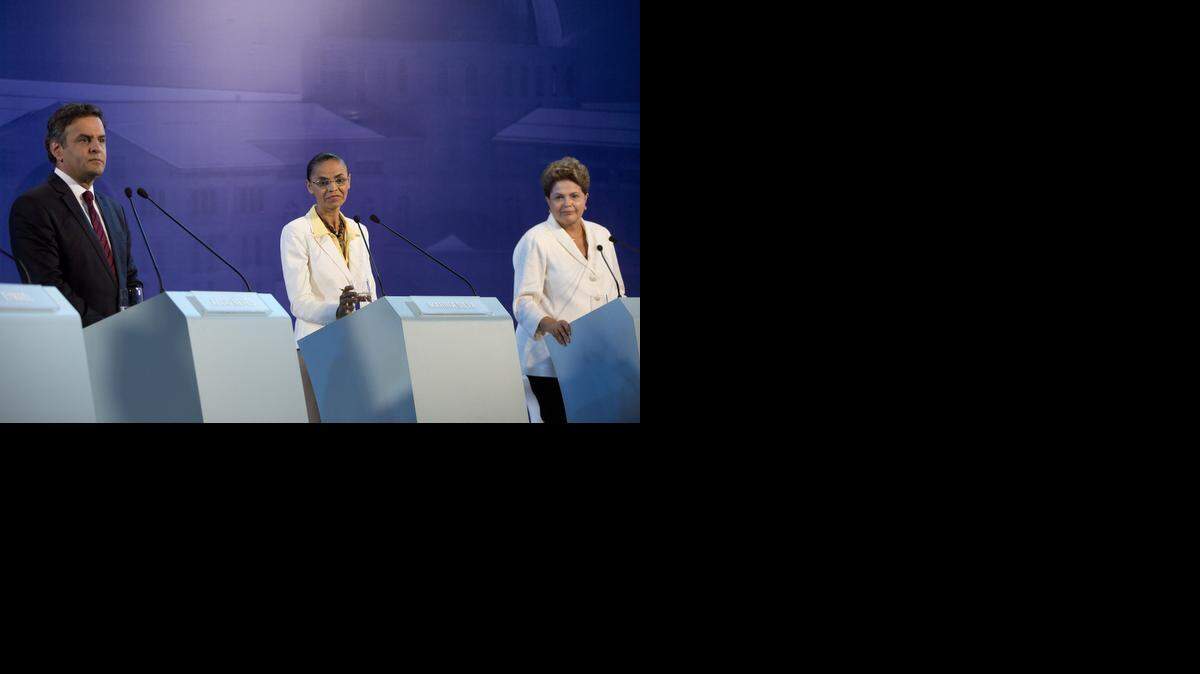 
RUNNING IN BRAZIL: Aecio Neves of the Social Democracy Party, Marina Silva of the Socialist Party, center, and  President Dilma Rousseff of the Workers Party during a presidential debate earlier this month.


