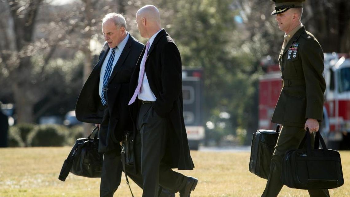 President Donald Trump's Chief of Staff John Kelly, left, and White House Director of Legislative Affairs Marc Short, second from left, walk toward Marine One on the South Lawn of the White House in Washington, Friday, Jan. 5, 2018, to travel with President Donald Trump to Camp David in Maryland.