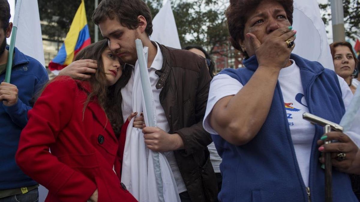 People react to the rejection of a peace deal with the Revolutionary Armed Forces of Colombia (FARC) following a peace deal with the Revolutionary Armed Forces of Colombia (FARC) in Bogota, Colombia, on Oct. 2, 2016.