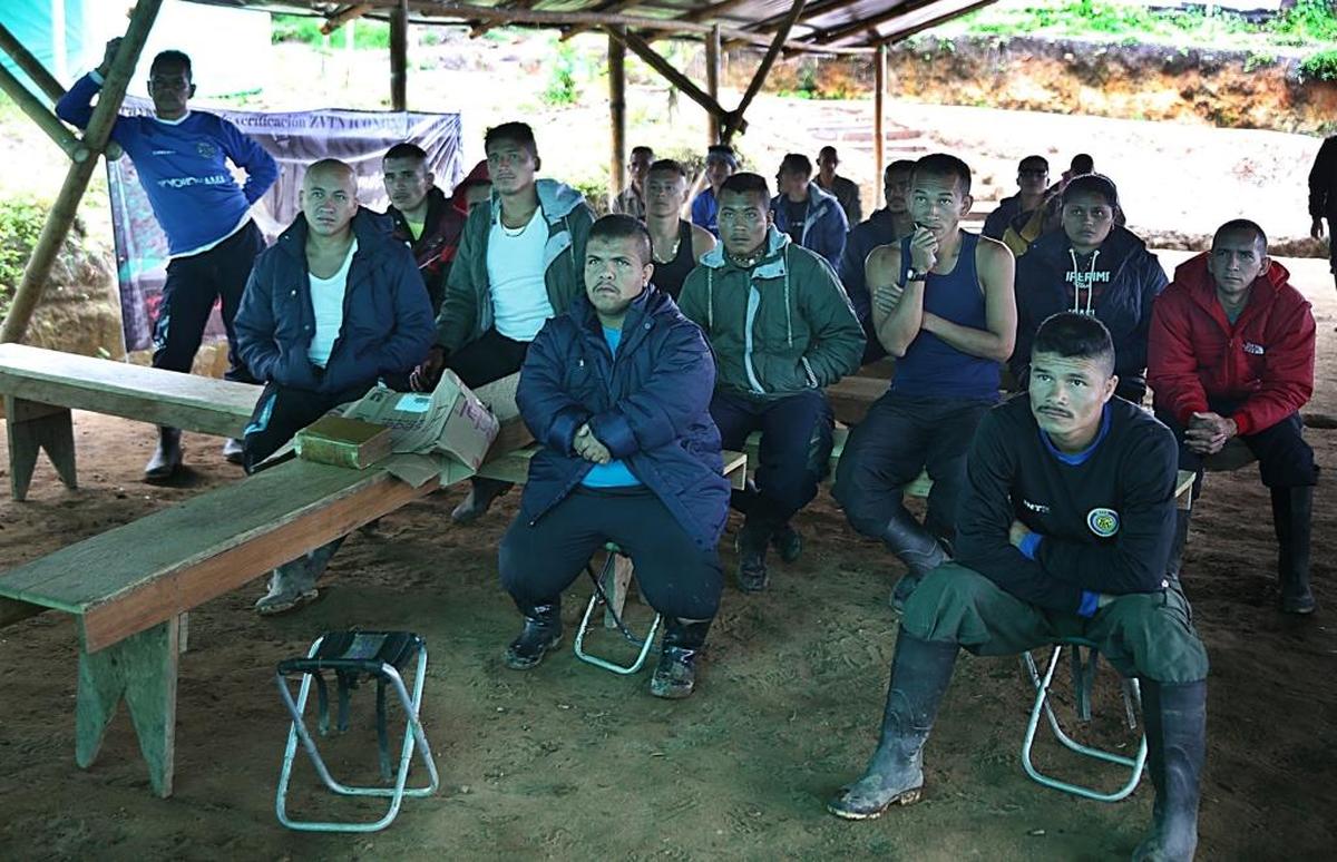 A group of Colombia's FARC guerrillas watch a soccer match at a “normalization” zone near the town of Icononzo. The camp is one of 26 where the FARC have gathered as they begin the transition to civilian life in the wake of a historic peace deal last year.