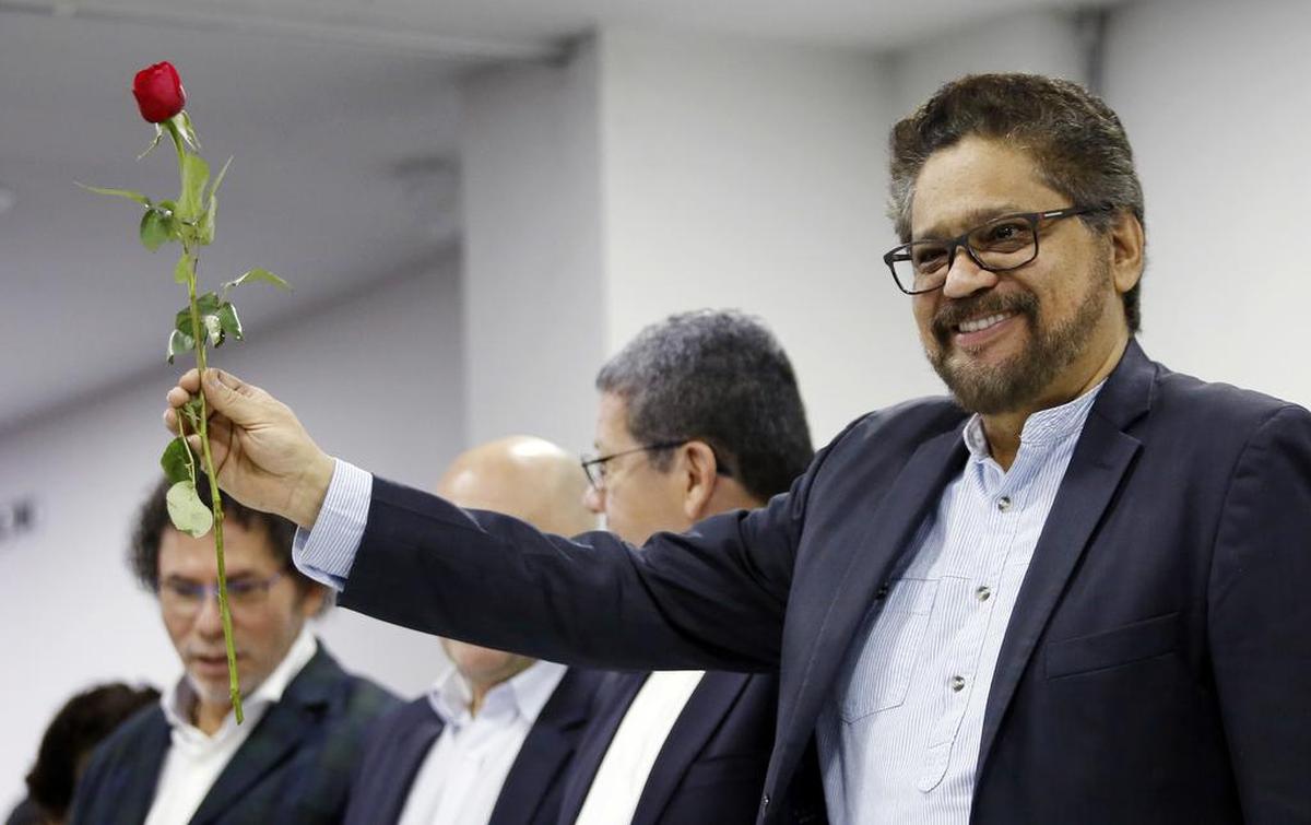 Ivan Marquez holds a red rose, the symbol of the new political party Alternative Communal Revolutionary Forces, during a press conference in Bogota, Colombia, Friday, Sept. 1, 2017. Members of the Revolutionary Armed Forces of Colombia, or FARC, voted overwhelmingly to change the groupâ€™s name to the Alternative Communal Revolutionary Forces, scrubbing any reference to its armed past. Since both names in Spanish carry the acronym FARC, its common use name will remain unchanged.