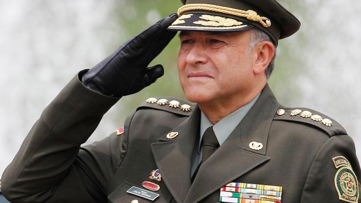 Colombia's national police chief, Gen. Oscar Naranjo, salutes during the arrival ceremony for Spain’s Prime Minister Mariana Rajoy at the presidential palace in Bogota, Colombia, in 2012.