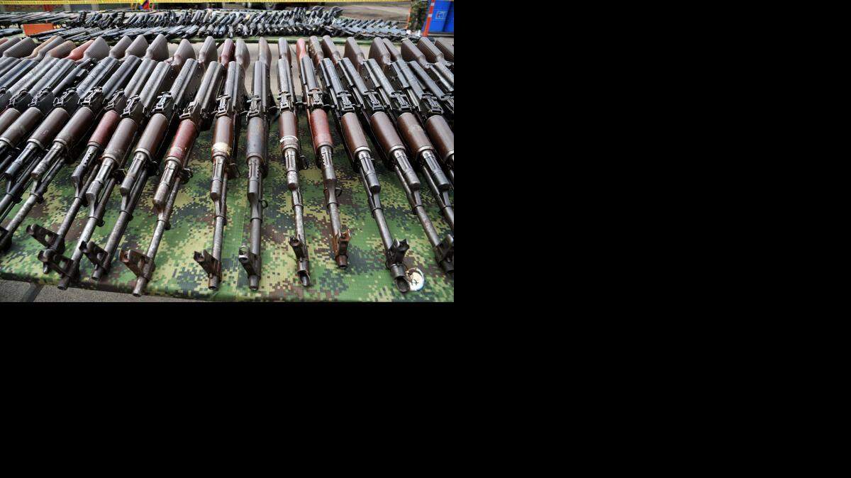 
Part of the 9,517 weapons seized from the FARC and ELN guerrillas criminal gangs and organized crime are seen before being meltedon November 25, 2014 in Sogamoso, Boyaca department, Colombia. 

