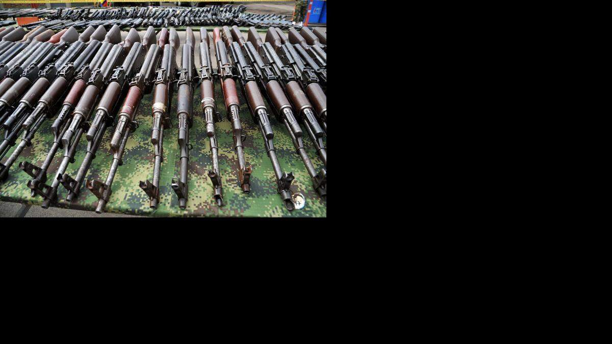 
Part of the 9,517 weapons seized from the FARC and ELN guerrillas criminal gangs and organized crime are seen before being melted in furnaces of the National Steel Factory (Sidenal), on November 25, 2014 in Sogamoso, Boyaca department, Colombia. The metal (iron and steel), obtained from these weapons will be used in the manufacture of rods used to reinforce the foundations and columns of schools and hospitals in areas of armed conflict. 
