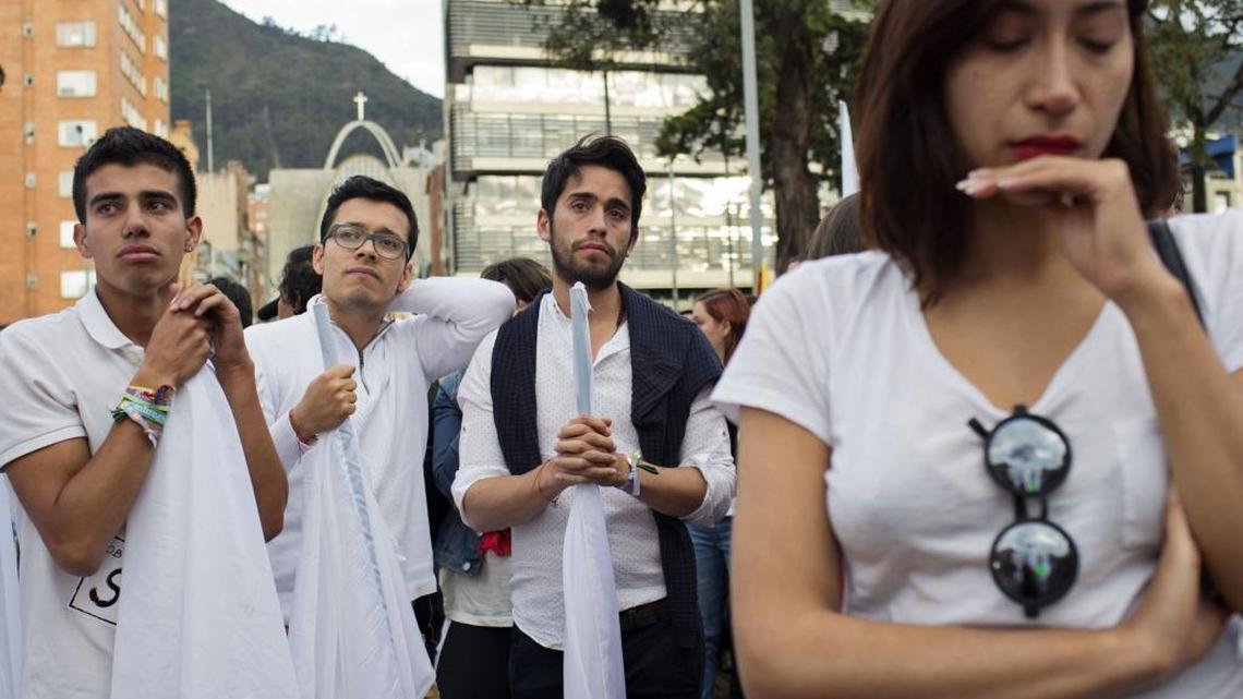 Colombians in the capital, Bogota, react after learning about the rejection of a peace deal with the Revolutionary Armed Forces of Colombia (FARC) following a plebiscite on Oct. 2, 2016.