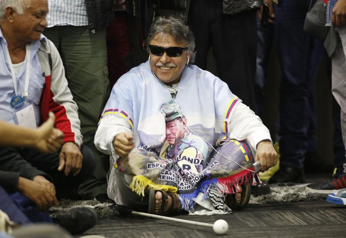 Former rebel leader Jesus Santrich attends a press conference announcing the new political party Alternative Communal Revolutionary Forces, in Bogota, Colombia, on Sept. 1, 2017. Members of the Revolutionary Armed Forces of Colombia, or FARC, voted overwhelmingly to change the group's name to the Alternative Communal Revolutionary Forces, scrubbing any reference to its armed past. Since both names in Spanish carry the acronym FARC, its common use name will remain unchanged.