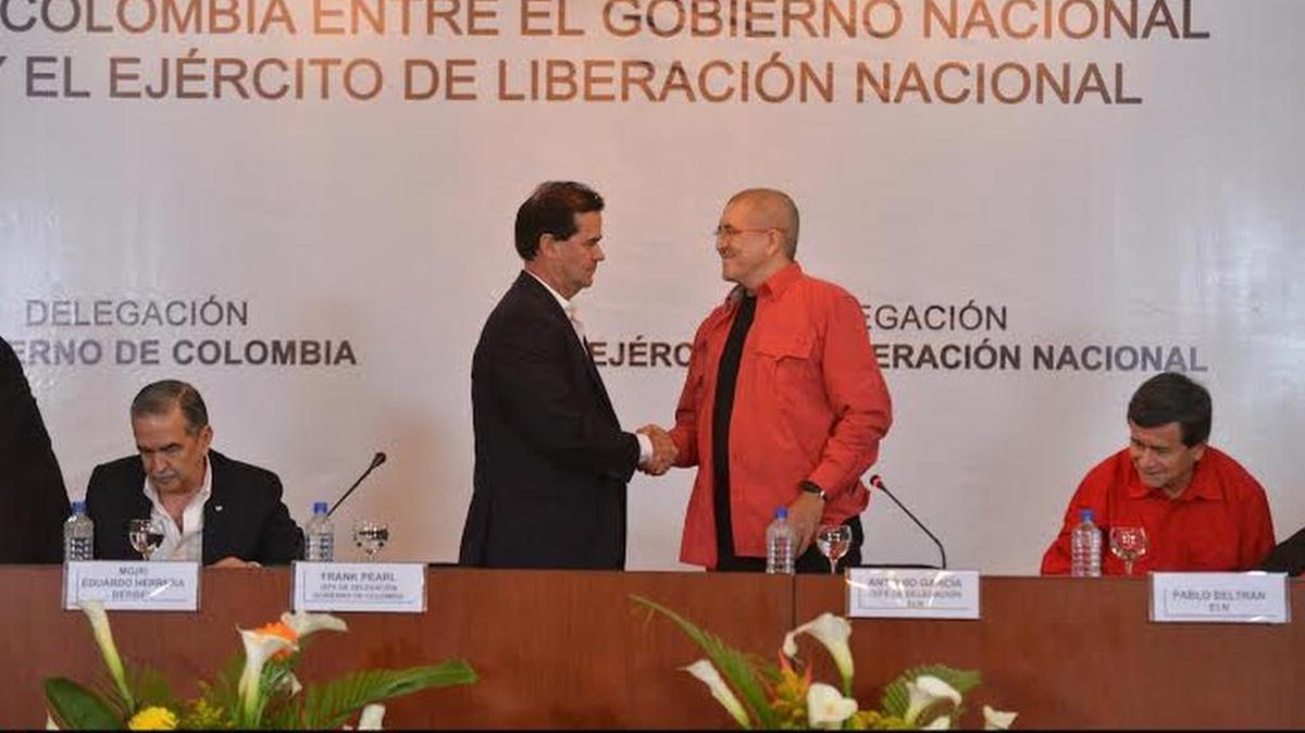 Colombian and ELN negotiators shake hands in this file photograph from March 2016.