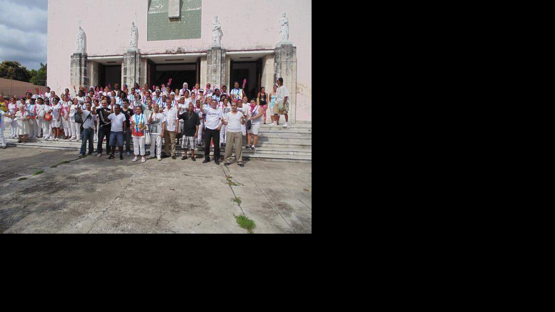 
Some of the 53 political prisoners that Cuba freed recently celebrate outside the church of Santa Rita in Havana with members of the Ladies in White dissident group on Jan. 11, 2014.

