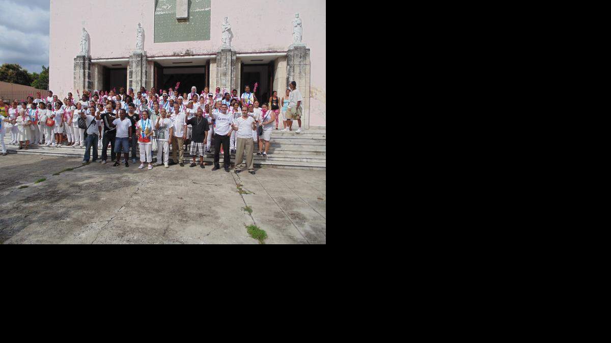 
Some of the 53 political prisoners that Cuba freed recently celebrate outside the church of Santa Rita in Havana with members of the Ladies in White dissident group on Jan. 11, 2014.
