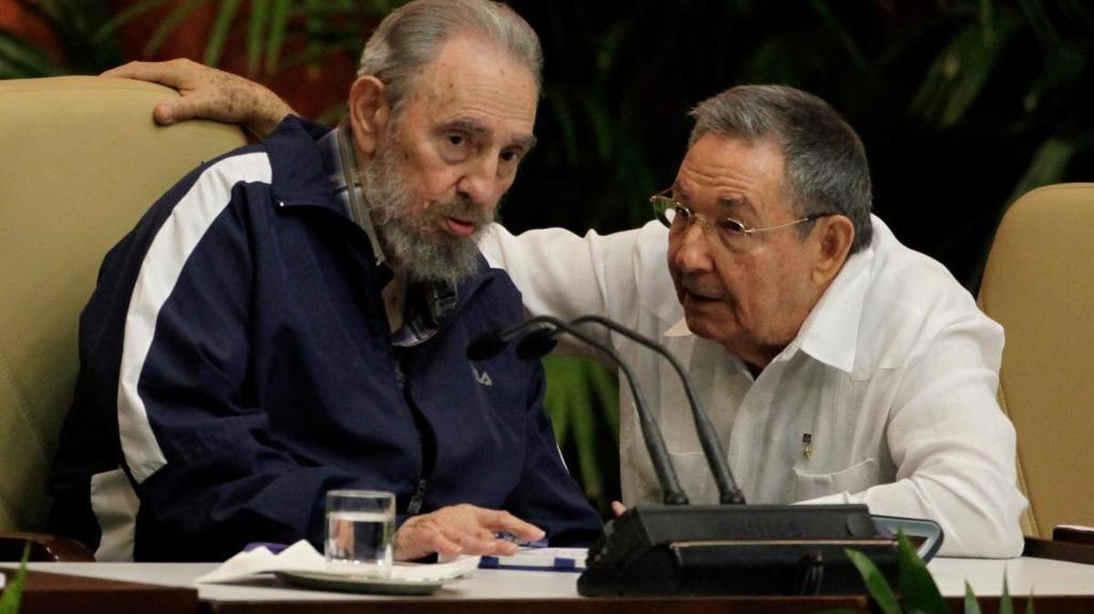 In this April 19, 2011 file photo, Fidel Castro, left, and his brother, Cuban leader Raúl Castro, talk during the 6th Communist Party Congress. Both Castros will be among the 1,000 delegates for the party’s seventh congress, which begins Saturday.