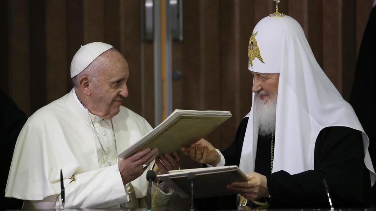 Pope Francis, left, and Russian Orthodox Patriarch Kirill exchange a joint declaration on religious unity at the Jose Marti International airport in Havana, Cuba, Friday, Feb. 12, 2016. The two religious leaders met for the first-ever papal meeting, a historic development in the 1,000-year schism within Christianity.