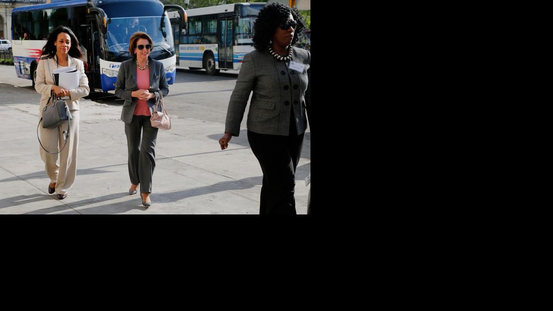 
House Minority Leader Nancy Pelosi, D-Calif., center, arrives at a hotel in Havana, Cuba, Tuesday, Feb. 17, 2015. The House Democratic leader arrived in Havana with a group of eight Democratic representatives for a series of meeting with U.S. diplomats, Cuban government officials and private citizens about U.S. and Cuban relations in wake of the Dec. 17 announcement by both countries that they would move to restore full relations. 
