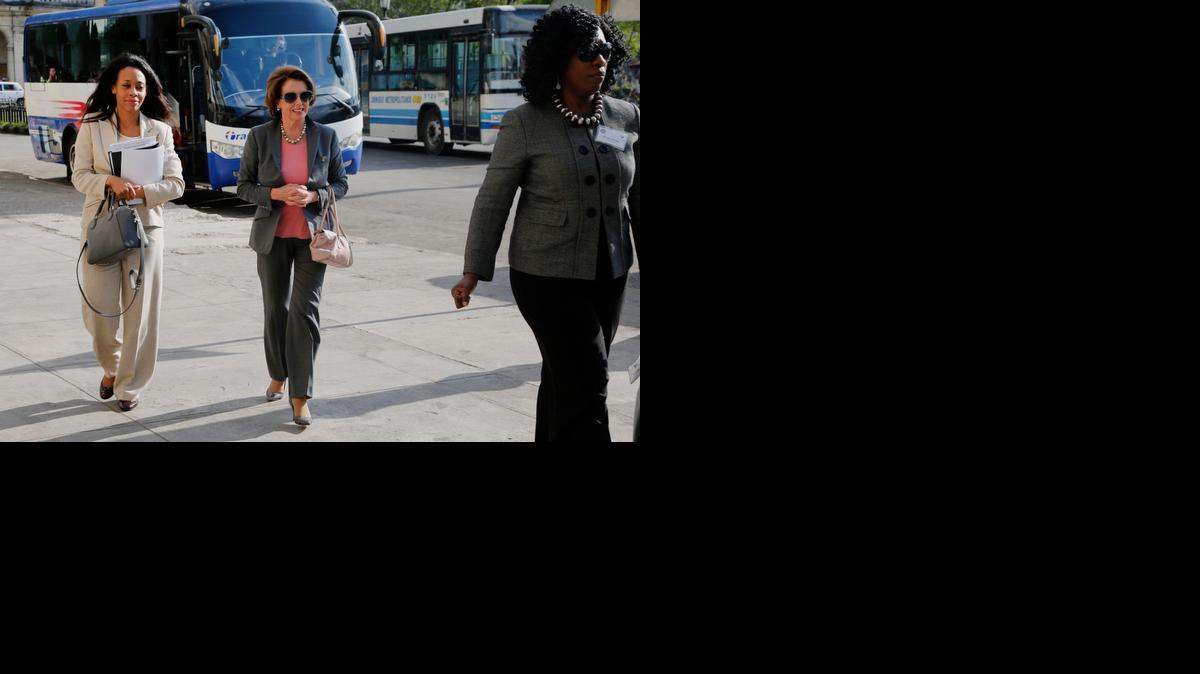 
House Minority Leader Nancy Pelosi, D-Calif., center, arrives at a hotel in Havana, Cuba, Tuesday, Feb. 17, 2015. The House Democratic leader arrived in Havana with a group of eight Democratic representatives for a series of meeting with U.S. diplomats, Cuban government officials and private citizens about U.S. and Cuban relations in wake of the Dec. 17 announcement by both countries that they would move to restore full relations. 
