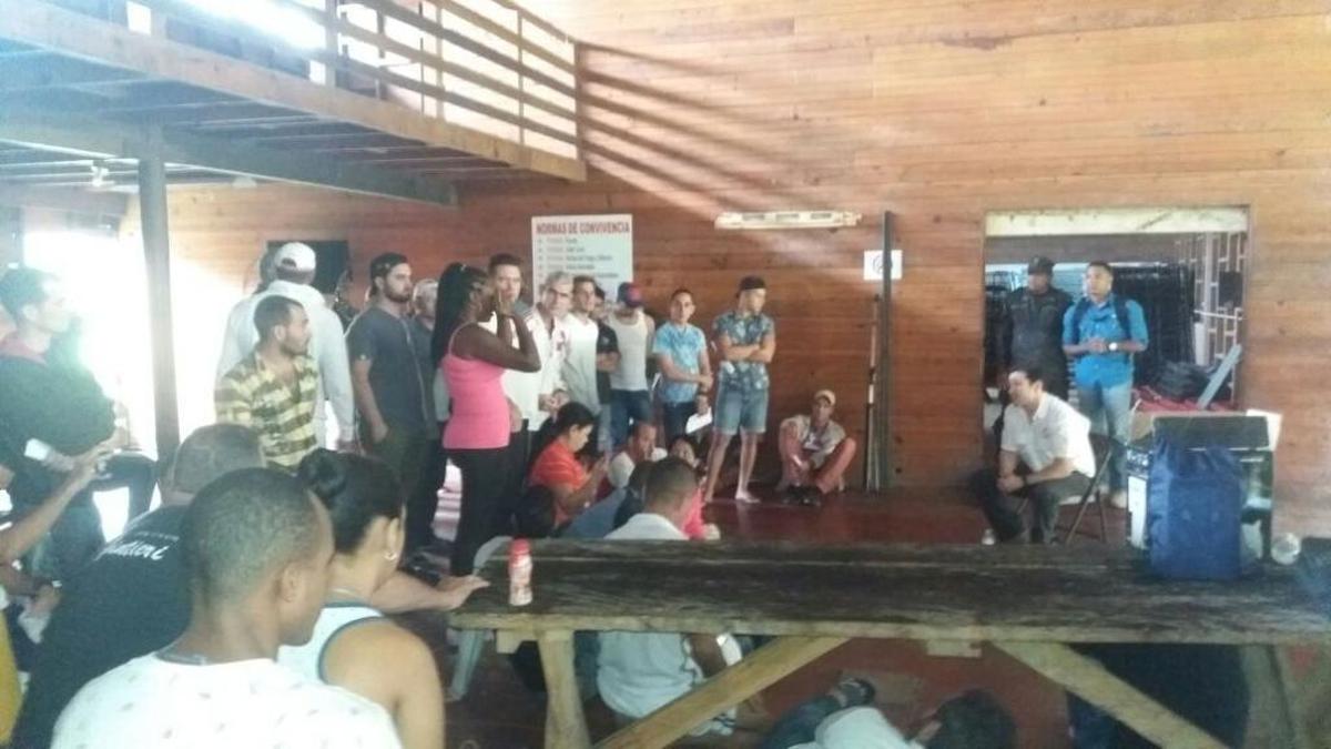 Deputy Minister of Public Security Jonathan del Rosario talks to Cuban migrants at a temporary shelter in Gualaca, Panama.