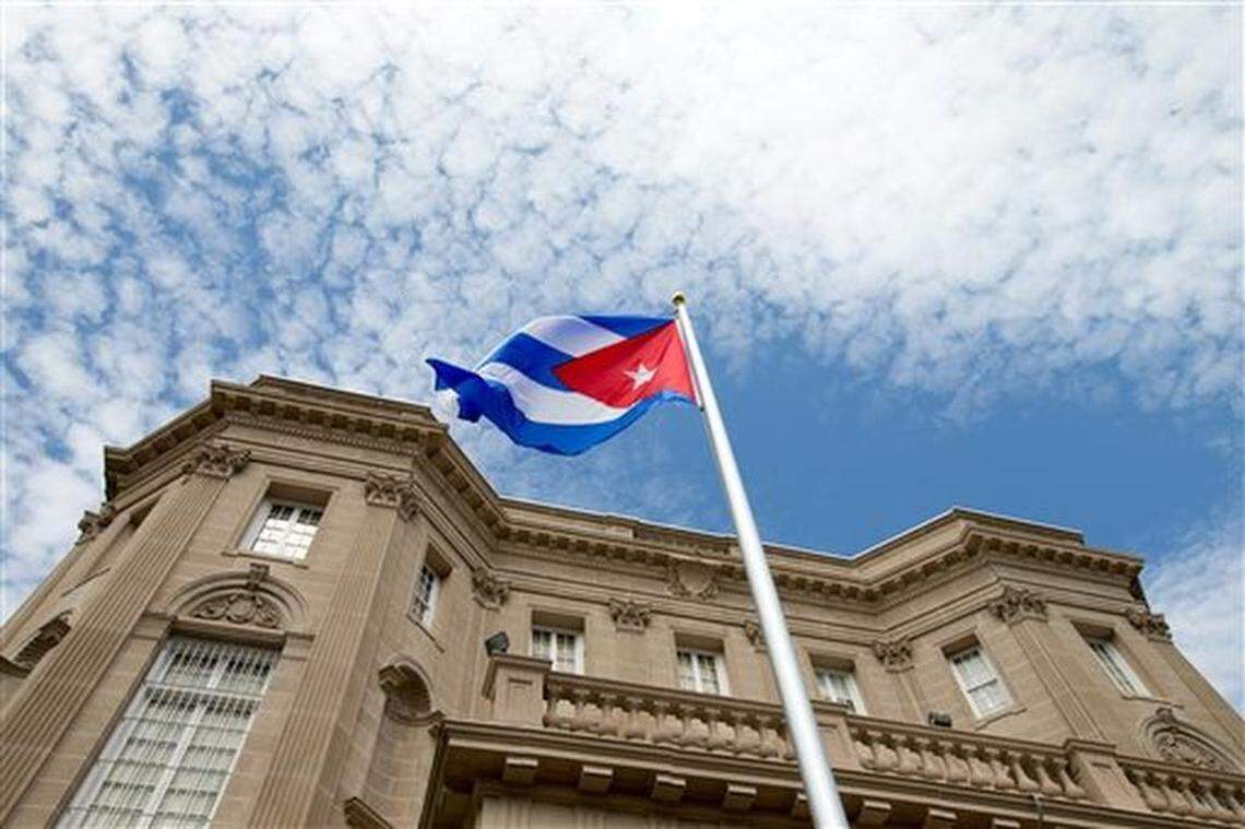 The Cuban flag is raised over their new embassy in Washington, Monday, July 20, 2015. Cuba's blue, red and white-starred flag was hoisted Monday at the country's embassy in Washington in a symbolic move signaling the start of a new post-Cold War era in U.S.-Cuba relations.
