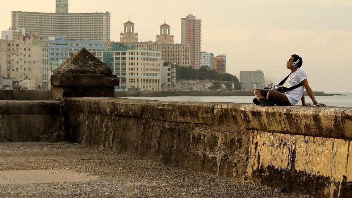 Whither U.S.-Cuba relations — A man listens to music while sitting on the seawall along Havana’s Malecón as daily life resumes in the capital city following a nine-day mourning period after the death of revolutionary leader Fidel Castro.