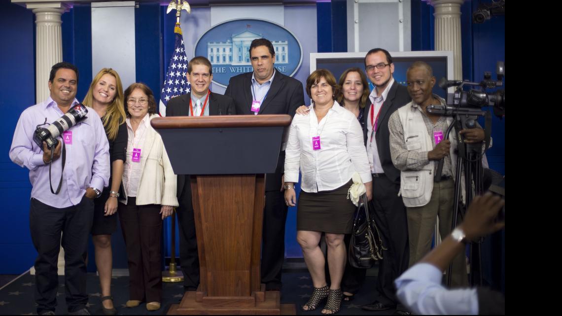 Cuban journalists pose for a group photo after attending the daily news briefing in the James Brady Press Briefing Room of the White House in Washington, Thursday, May 21, 2015. The group had visited the White House after covering the talks to re-establish diplomatic relations between the United States and Cuba, currently going on at the State Department. 
