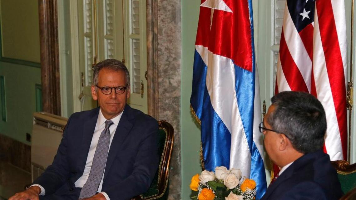 Jeffrey DeLaurentis, left, meets with Cuba's Interim Foreign Minister Marcelino Medina in Havana on July 1, 2015, prior to the reopening of the embassies.